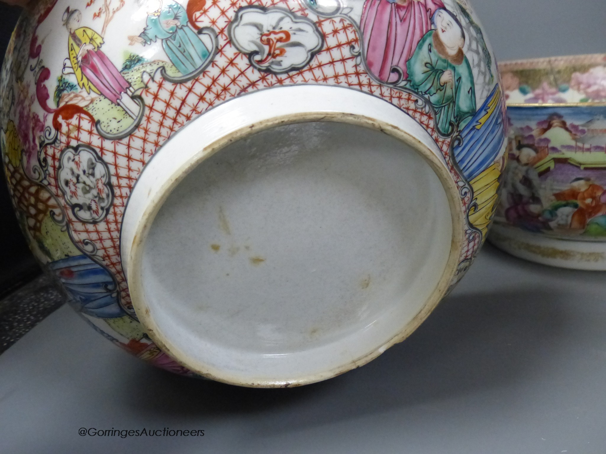 An 18th century Chinese Export famille rose punch bowl and another similar bowl (a.f.), largest 32cm diameter